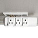 A white Innovera swivel plug surge protector with six outlets.