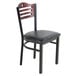 A Lancaster Table & Seating mahogany bistro chair with a black padded seat and wooden back.