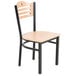 A wooden Lancaster Table & Seating chair with a black frame.