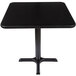 A black square table with a black base.