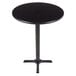 A black round table with a metal leg.