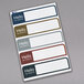 A package of Avery removable name badge labels in assorted matte colors.
