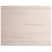A white rectangular wood board with a live edge and wood surface.