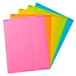 A pack of Avery assorted bright color labels with a pink label with blue writing on it.