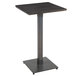 A Lancaster Table & Seating square wooden bar height table with a metal base.