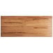 A rectangular wooden table surface with a live edge and natural wood finish.