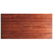 A rectangular wooden table top with a mahogany finish.