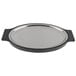 A stainless steel oval sizzler platter with black handles.