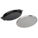 A black oval shaped tray with a stainless steel plate on top.