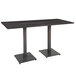 A black rectangular Lancaster Table & Seating bar height table with two metal legs.