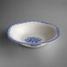 A white bowl with blue floral designs.