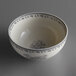 A white bowl with grey and black floral design.