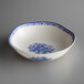 A white porcelain bowl with blue floral designs.