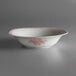A white porcelain bowl with pink trim.