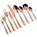 A close-up of a few rose gold Bon Chef oyster forks.