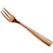 A close-up of a rose gold Bon Chef oyster fork.