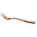 A close up of a Bon Chef rose gold stainless steel oyster fork.