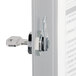 A Durable silver brushed aluminum key cabinet with a key in a lock.