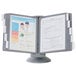 A Durable gray medical information board with borders and a couple of people on it.