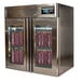 A Stagionello stainless steel meat curing cabinet with two glass doors and meat on racks inside.
