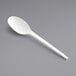 A close-up of an EcoChoice CPLA white plastic spoon.