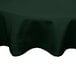 A hunter green poly/cotton blend round table cover with hemmed edges.