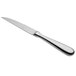 A Oneida Baguette stainless steel steak knife with a silver handle.