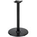 A Lancaster Table & Seating black cast iron round counter height table base with a round base and pole.