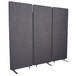 Three Luxor grey fabric partition screens with metal legs.