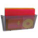 A Deflecto smoke wall file holder with a red folder and stack of papers in it.