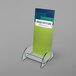 A clear acrylic holder with a green and blue rectangle on it.