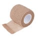 A roll of brown Medi-First self adhesive wrap.