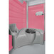 A pink and grey PolyJohn portable restroom with a sink and toilet.