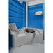 A PolyJohn portable restroom with a blue and white exterior and a black lid.