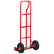 A red metal hand truck with black wheels.