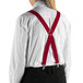 A person wearing Henry Segal red clip-end suspenders over a white shirt.