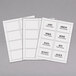 A stack of white rectangular C-Line printable name badge labels.