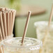 An EcoChoice paper straw in a plastic cup.