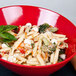 A red GET Red Sensation melamine bowl filled with pasta, broccoli, and cheese.