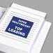 A white paper with a blue sign inside a C-Line Super Heavy Weight Top-Loading Sheet Protector.
