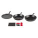 A Lodge 7-piece cast iron skillet set with red silicone handles.
