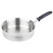 A close-up of a silver Vollrath saute pan with a black silicone-coated handle.