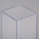A clear rectangular acrylic vase with a square top.