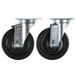 A pair of 5" swivel plate casters with black rubber wheels.