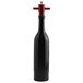 A black bottle with a red handle and stopper.