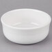 A Fiesta white china chowder bowl on a gray surface.