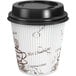A white paper Choice coffee cup with a brown bean print and black lid.