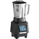 A Waring commercial blender with a stainless steel container and black and silver accents.
