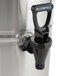 A Bloomfield stainless steel iced tea dispenser with a black plastic faucet handle.