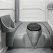 A white PolyJohn portable restroom with a sink, soap, and towel dispenser.